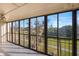 Screened-in lanai offering scenic views of the outdoors at 9433 Harbor Greens Way # 403, Seminole, FL 33776