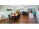 Open living room featuring hardwood floors and leather furniture at 9433 Harbor Greens Way # 403, Seminole, FL 33776
