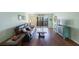 Living room with leather couches and a wood coffee table at 9433 Harbor Greens Way # 403, Seminole, FL 33776