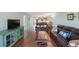 Living room with leather sofas and a large TV at 9433 Harbor Greens Way # 403, Seminole, FL 33776