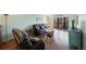 Relaxing living room with leather sofas and wood floors at 9433 Harbor Greens Way # 403, Seminole, FL 33776