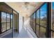Spacious screened balcony overlooks lush landscape at 9433 Harbor Greens Way # 403, Seminole, FL 33776