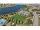 Aerial view showing tennis courts, pool, and community green space at 9605 Sage Creek Dr, Ruskin, FL 33573