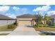 Single-story home with attached two-car garage at 9605 Sage Creek Dr, Ruskin, FL 33573