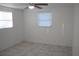 Bright bedroom with tile flooring and window coverings at 1030 Landau St, Holiday, FL 34690