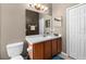 Clean bathroom with a vanity and a toilet at 12610 Saulston Pl, Hudson, FL 34669