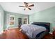 Spacious bedroom with wood floors and large windows at 12610 Saulston Pl, Hudson, FL 34669