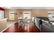 Dining area with table and chairs adjacent to the living room at 12610 Saulston Pl, Hudson, FL 34669