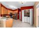 Bright kitchen with stainless steel appliances and laundry area at 12610 Saulston Pl, Hudson, FL 34669