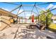 Relaxing screened patio, perfect for outdoor dining and entertaining at 12610 Saulston Pl, Hudson, FL 34669