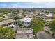 Aerial perspective of community, showcasing building and landscape at 1403 Cordova Grn, Seminole, FL 33777