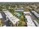 Aerial view of community featuring buildings and a central pool at 1403 Cordova Grn, Seminole, FL 33777