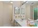 Clean bathroom featuring a vanity, mirror, and toilet at 1403 Cordova Grn, Seminole, FL 33777
