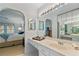 Main bathroom with double vanity and view of bedroom at 1403 Cordova Grn, Seminole, FL 33777