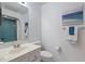 Clean bathroom with vanity, toilet, and shower at 1403 Cordova Grn, Seminole, FL 33777
