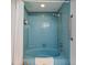 Retro bathroom with a blue bathtub and shower at 1403 Cordova Grn, Seminole, FL 33777