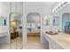 Main bathroom with double vanity and access to bedroom at 1403 Cordova Grn, Seminole, FL 33777