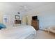 Spacious bedroom with a ceiling fan and dresser at 1403 Cordova Grn, Seminole, FL 33777