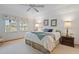 Large bedroom with a king-size bed and ceiling fan at 1403 Cordova Grn, Seminole, FL 33777