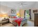 Bright bedroom with a queen-size bed and window at 1403 Cordova Grn, Seminole, FL 33777