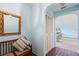Bright entryway with a bench, mirror, and access to other rooms at 1403 Cordova Grn, Seminole, FL 33777