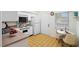 Cozy kitchen with white cabinets, an eat-in area, and tiled floors at 1403 Cordova Grn, Seminole, FL 33777