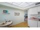 Kitchen with white cabinets and a breakfast nook at 1403 Cordova Grn, Seminole, FL 33777