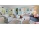 Living room with a view of the lanai and access to the dining area at 1403 Cordova Grn, Seminole, FL 33777