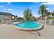 Community pool with patio furniture and a surrounding fence at 1403 Cordova Grn, Seminole, FL 33777