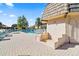 Partial view of the community pool and surrounding patio at 1403 Cordova Grn, Seminole, FL 33777