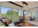 Spacious screened balcony offering leafy views and interior access at 1403 Cordova Grn, Seminole, FL 33777