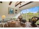 Bright sunroom with tiled floor and screened balcony at 1403 Cordova Grn, Seminole, FL 33777