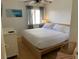 Spacious bedroom with king-size bed and wood flooring at 1515 Pinellas Bayway S # 45, St Petersburg, FL 33715