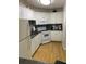 Well-equipped kitchen with white cabinets and appliances at 1515 Pinellas Bayway S # 45, St Petersburg, FL 33715