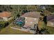 Aerial view showing home, pool, and landscaping at 1610 Brilliant Cut Way, Valrico, FL 33594