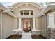 House entrance with double doors and stone pillars at 1610 Brilliant Cut Way, Valrico, FL 33594