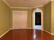 Living room with hardwood floors and view to another room at 19329 Autumn Woods Ave, Tampa, FL 33647