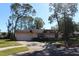 One-story house featuring a pink exterior and spacious yard at 2095 59Th N St, Clearwater, FL 33760