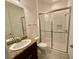 Bathroom with shower, granite vanity, and toilet at 2119 Scholartree Way, Wesley Chapel, FL 33543