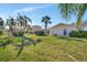 Large backyard with grassy area and partial view of home at 219 Leeward Is, Clearwater Beach, FL 33767