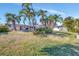 Large backyard with pool and tropical landscaping at 219 Leeward Is, Clearwater Beach, FL 33767