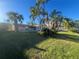 Large backyard with canal access and palm trees at 219 Leeward Is, Clearwater Beach, FL 33767