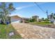 Single-Gathering home with a two-car garage and paved driveway at 219 Leeward Is, Clearwater Beach, FL 33767