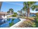 Relaxing pool area with canal views and palm trees at 219 Leeward Is, Clearwater Beach, FL 33767