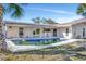 Inviting pool area with covered patio and canal view at 219 Leeward Is, Clearwater Beach, FL 33767