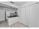 Modern kitchen with granite countertop and white cabinets at 2473 Bentley Dr, Palm Harbor, FL 34684