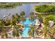 Aerial view of community pool, water features, and surrounding landscape at 322 Ibisview Ln, Apollo Beach, FL 33572