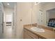 Clean bathroom with vanity, sink, and access to bedroom at 322 Ibisview Ln, Apollo Beach, FL 33572