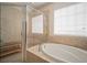 Bathroom featuring a shower and a large soaking tub at 322 Ibisview Ln, Apollo Beach, FL 33572