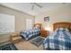 Two twin beds with matching bedding in a well-lit bedroom at 322 Ibisview Ln, Apollo Beach, FL 33572